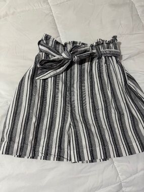 Express striped paperbag waist shorts with a tie belt.